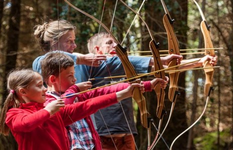A family shooting arrows