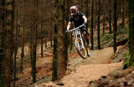 Mountain biking down a steep slope