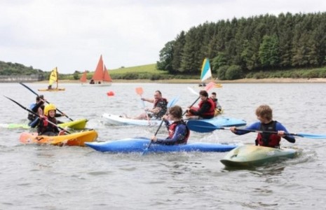 Group canoeing on a Lake